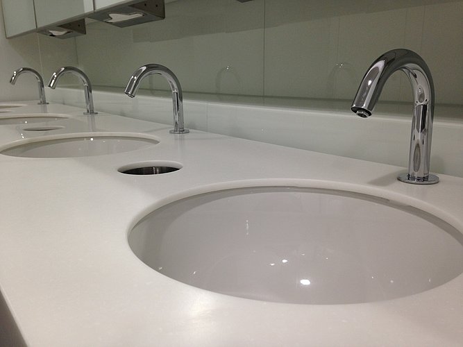 Fully accessible rimless toilet in a public facility