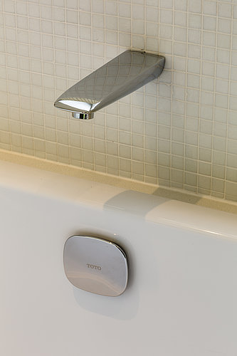 Stainless steel shower faucet in Sir Stirling Moss's private residence in London