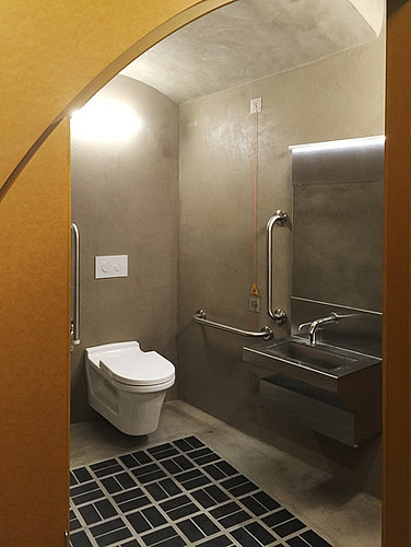 Public bathroom with rimless toilet at Building Centre London